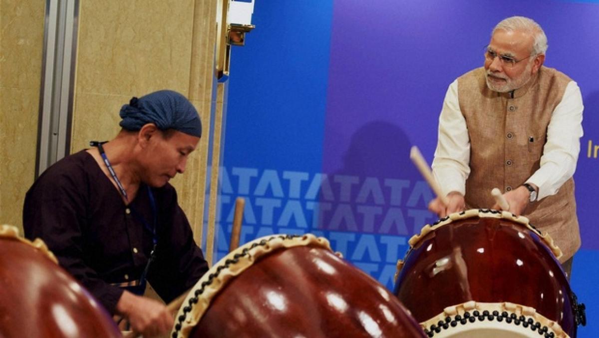 PM Modi tries his hands at drums in Meghalaya